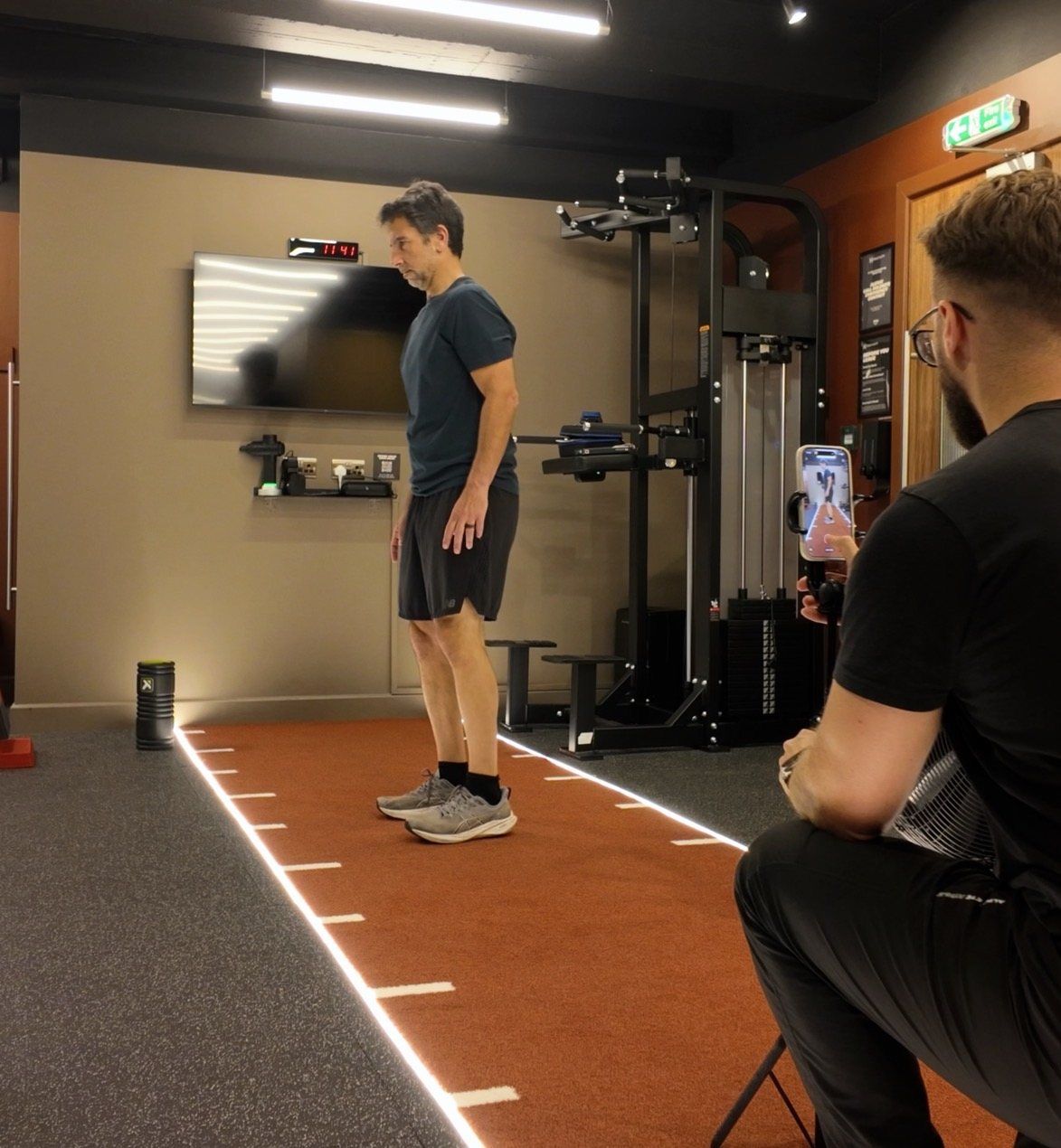 Giacomo Di Mauro filming a client's jump test on a phone